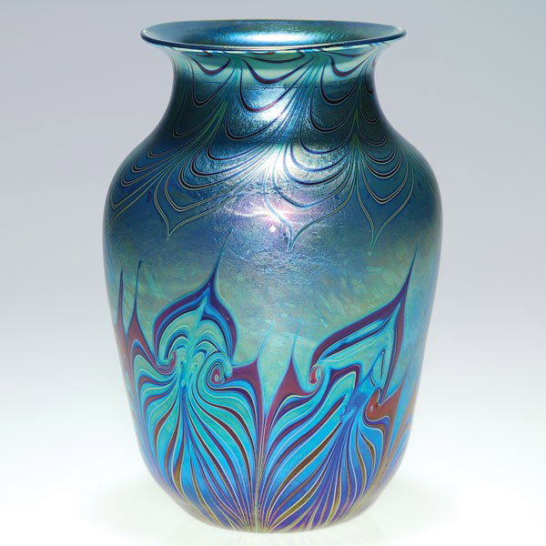 Early Orient & Flume blue vase, decorated, 7", 197: Early Orient & Flume blue aurene vase encircled with flame like design in deep red pulled from the base and drape designs cascading the shoulder. Height 7 inches. Signed "Orient & Flume" with the 1979