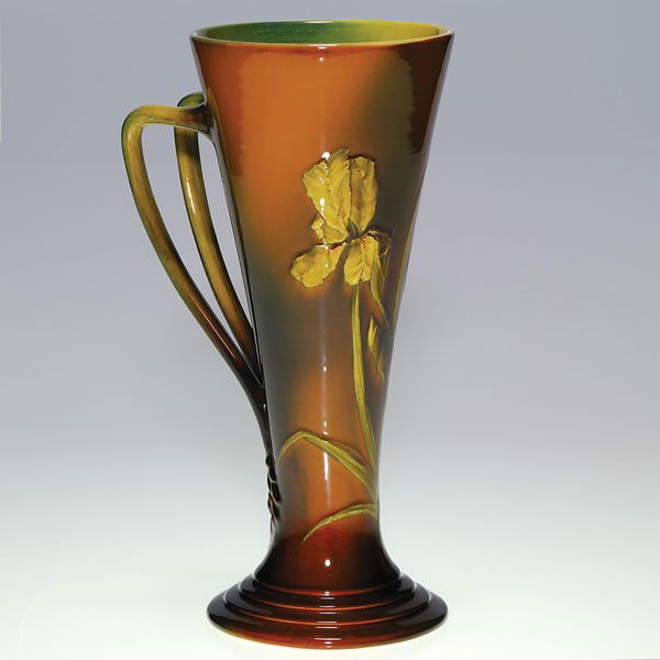 Rookwood Standard Glaze 10 1/4" mug, AMV, 1891: Standard Glaze 10 1/4 inch mug, decorated in 1891 by Anna Marie Valentien, who deployed irises onto the vessel. Impressed with the Rookwood logo, which indicates the date, shape 292 C and a W for the