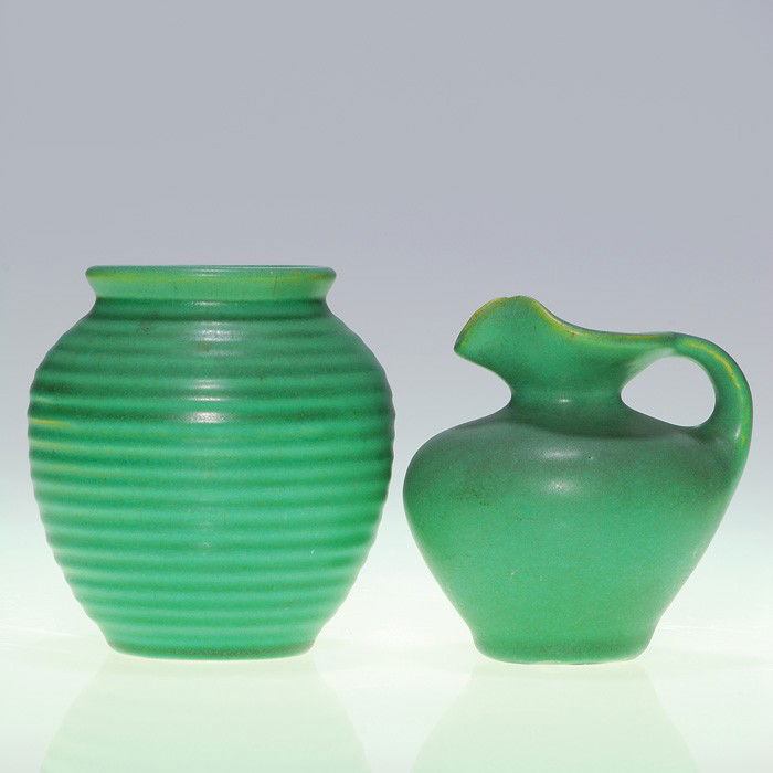 Two Teco items, cruet 3 7/8" & ribbed vase 4 1/8": Lot of two Teco items: a 3 7/8 inch cruet and a 4 1/8 inch ribbed vase, each covered with the Pottery's signature mat green glaze. Each is impressed twice with the Teco logo. Both pieces are in excell