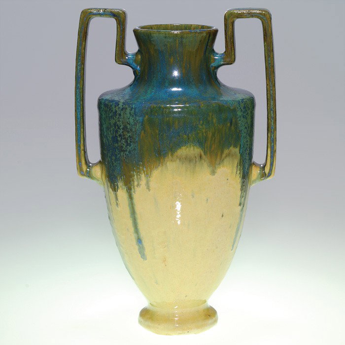 Tall Fulper vase, square handles, blue over cream : Tall Fulper vase with two squared off strap handles done in a vibrant turquoise crystalline glaze dripped over a gloppy oatmeal. Marked with the raised oval vertical Fulper logo. Height 13 3/4 inches.