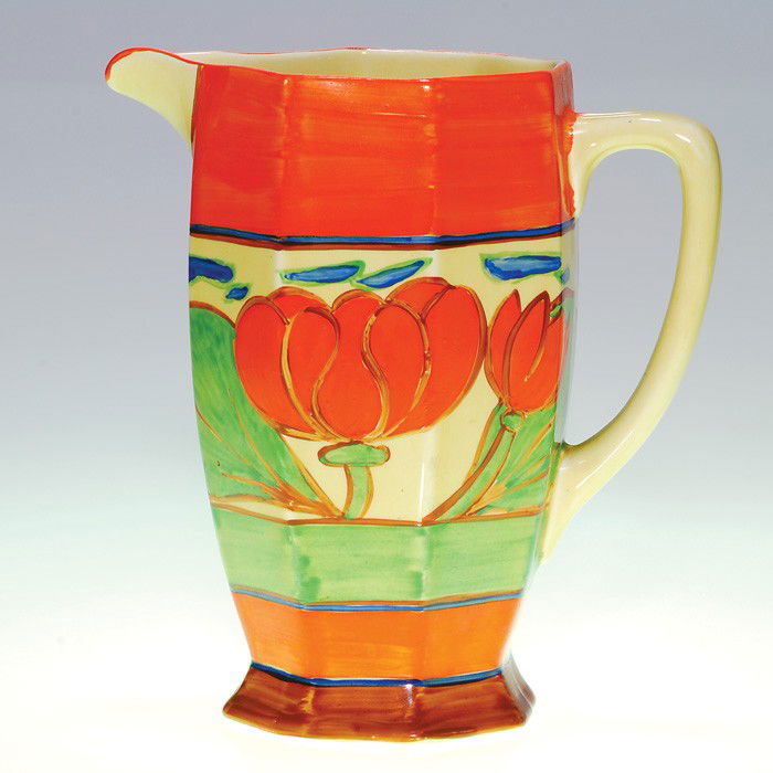 Clarice Cliff "Fantasque" pitcher, 7 7/8": Clarice Cliff "Fantasque" pitcher with lotus blossoms. Marked "Hand Painted Fantasque by Clarice Cliff Wilkinson Ltd England." Height 7 7/8 inches. Excellent original condition.