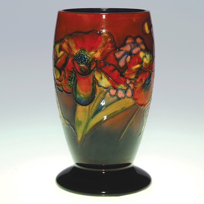 Moorcroft "Orchid" vase in Flambe' glaze, 9 3/8": Moorcroft "Orchid" vase done in a rich, red Flambe' glaze. Impressed factory mark with facsimile signature, painted William Moorcroft signature and impressed "Made in England." Height 9 3/8 inches. St