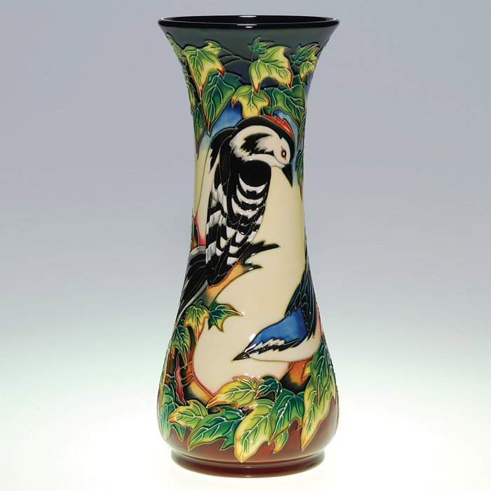 Recent Moorcroft vase, birds, exotic foliage, 12": Moorcroft vase made in 2002 with a complex design of birds and exotic foliage. Done in lush colors and lined in black, the vase is signed by several artisans, dated and impressed "Moorcroft Made in St
