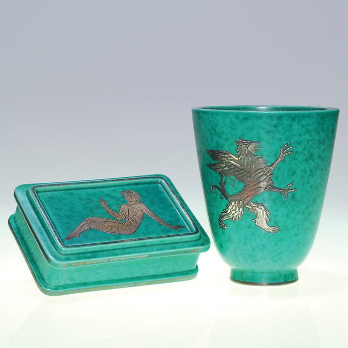 2 Gustavsberg Argenta items, beaker & covered box: Two Gustavsberg Argenta pieces. 1). Beaker with a rampant griffin in silver on the side. Marked "Gustavsberg 978 Made in Sweden" in silver on the bottom along with a small anchor. Also marked with an 