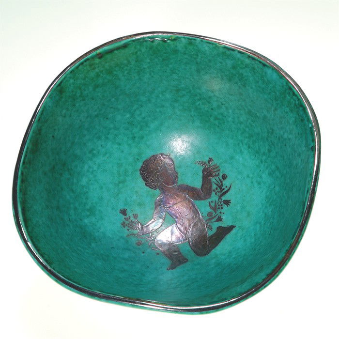 Gustavsberg Argenta bowl, cherub interior, Kage: Gustavsberg Argenta bowl, a Wilhelm Kage design, showing a cherub with flowers on the inside. Marked "Gustavsberg Kage 989" in silver on the bottom along with a small anchor. Height 2 3/4 inches. Exce