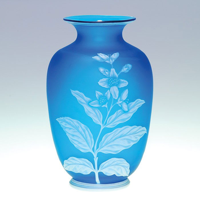 Thomas Webb cameo vase, floral, 6 7/8": Thomas Webb & Sons English cameo vase with a light blue tall leafy stalk with flowers and buds on the front and a butterfly on the back. Decorative rim and base. Height 6 3/4 inches. Acid marked "Thom