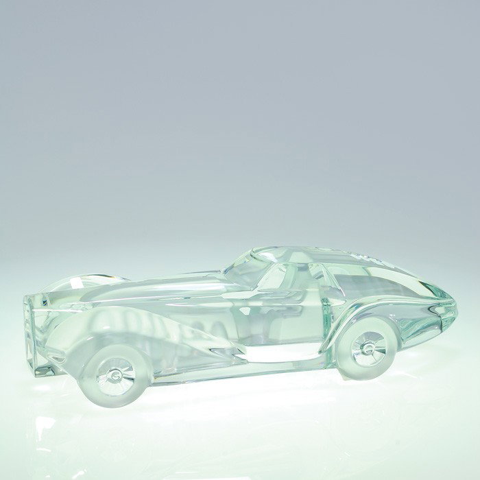 Daum "Coupe Riviera", crystal, length 15 1/2", sig: Stylish Daum "Coupe Riviera" automobile cast from lead crystal, a 1984 design by Xavier Frissart. The driver and passenger seats, engine and trunk area are frosted providing good detail as well as the