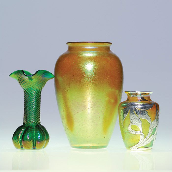 3 Loetz vases: Classic + green ribbed + silver: Trio of Loetz vases. First a 7 inch classical "Candia Silberiris" with rainbow iridescence. Second a 5 inch emerald green with threading that spirals the melon base to the four corner rim. Third is a