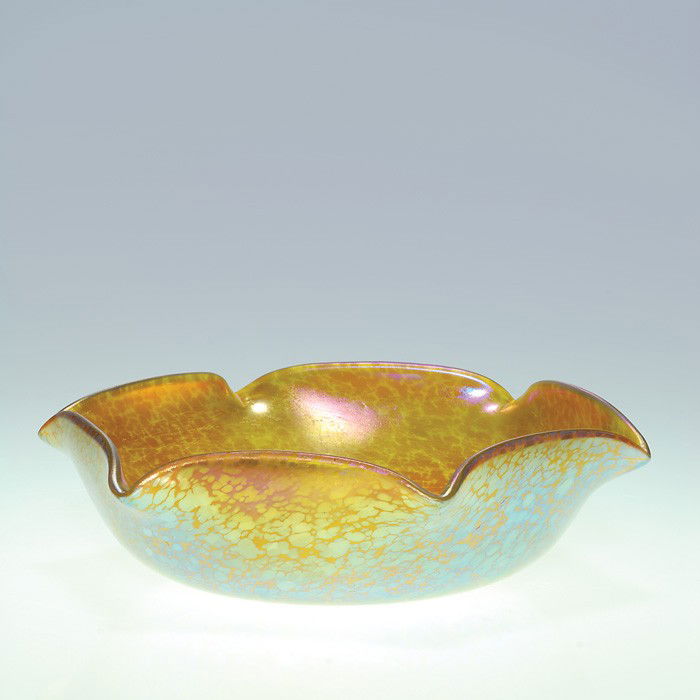 Loetz Czech gold Papillon star form bowl, 2 1/2": Iridescent gold Czech Loetz bowl, the exterior speckled with the Papillon pattern. The rim has been uniformly pulled that resembles a six pointed star. Height 2 1/2 inches, the diameter 9 1/4 inches.
