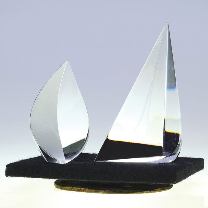 2 Christopher Ries glass sculptures, 5 1/4", 3 5/8: Two Christopher Ries glass sculptures impeccably carved and polished. First is "Sail" measuring 5 1/4 inches with a 3 inch base, contrived in 1982. Perfect condition. Second is "Lotus" displaying a fr