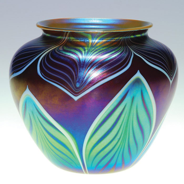 Orient & Flume vase, aurene blue leaves, plum,5": Good Orient & Flume cased vase with aurene blue leaves tugged from the rim and up from the base across a pretty plum backdrop. Yellow opal cases the interior. Height 5 1/4 inches. Engraved "Orient & F
