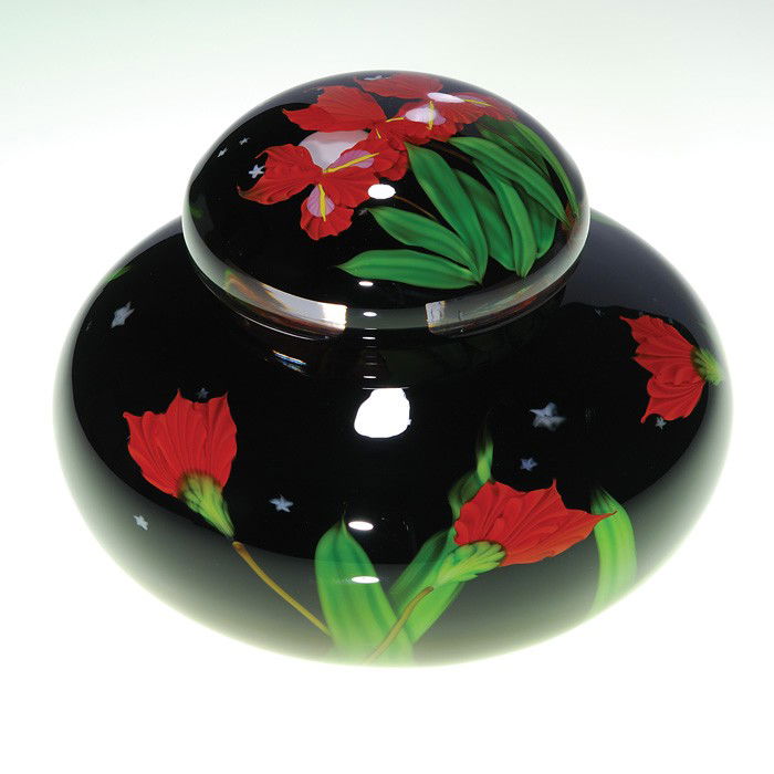 Mayauel Ward covered vessel, Iris Moon, 5 3/4": Beautiful covered vessel created by glass artist Mayauel Ward in 2008. A full harvest moon under an ebony starry starry sky that peeks between triplets of red irises arranged on the cover. The vessel