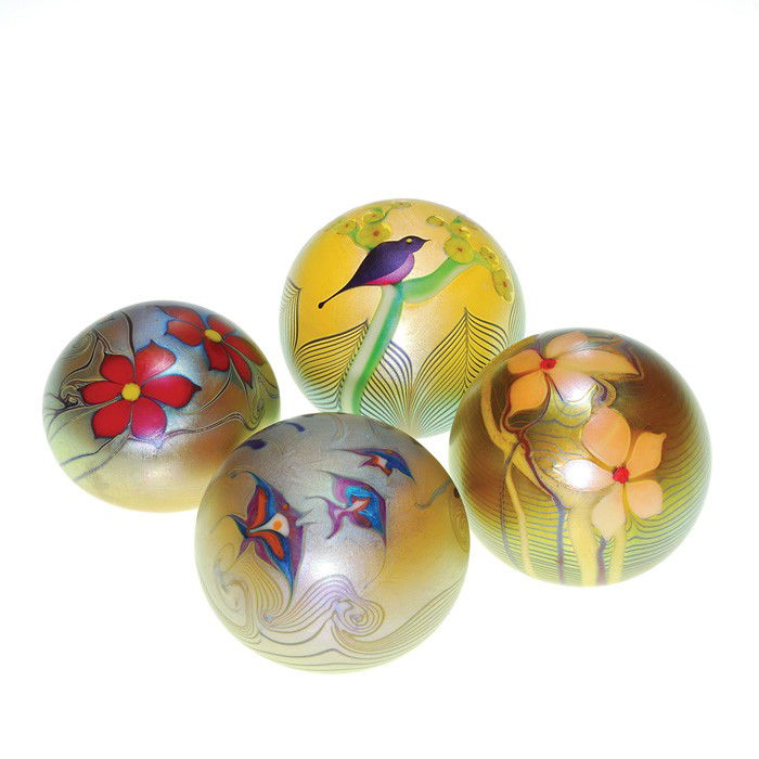 4 Early Orient and Flume paperweights,flora, fauna: Four early Orient & Flume paperweights exhibiting flora or fauna with pulled or combed patterns. 1978 has a robin in a yellow flowering tree. 1976 has a trio of fish among millefiori reeds, accompanie