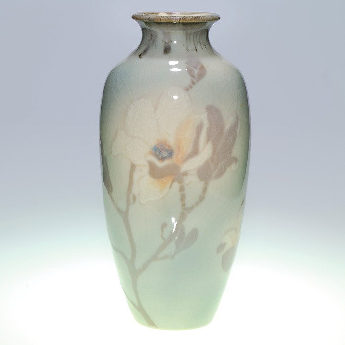 Rookwood 15 3/4" lamp vase, magnolia, 1948, LH: Tall lamp vase cast in 1948 and encircled with magnolia blossoms, buds and branches, the work of Loretta Holtkamp in 1948. Impressed with the Rookwood logo, the date, shape 2984 A and having a cast ho