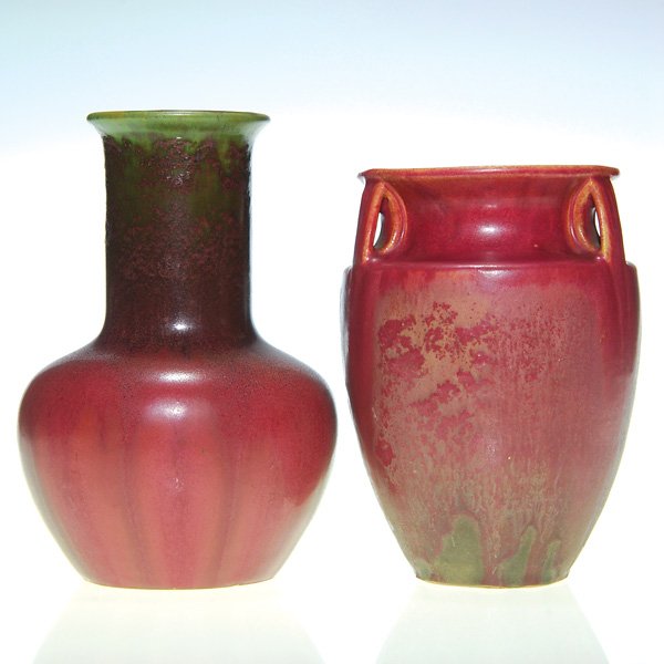 Fulper lot of 2: 6 3/4” & 7 1/2” vases, green-red: Two Fulper vases marked with the racetrack logo. First a 6 3/4 inch tri-handled bullet shape coated with a matte and slightly textured Famille Rose glaze splashed with grayish green. Second a 7 1/2 in