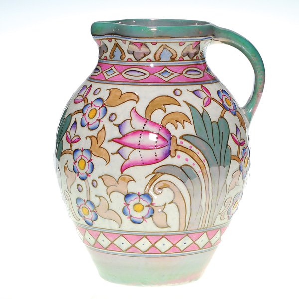 Charlotte Rhead Bursley Ware pitcher, 9 3/8": Colorful Charlotte Rhead 9 3/8 inch pitcher covered with a gardenful of flowers, in lustre glaze, much applied by tube lining.Marked with the “Bursley Ware Charlotte Rhead England” ink stamp and m