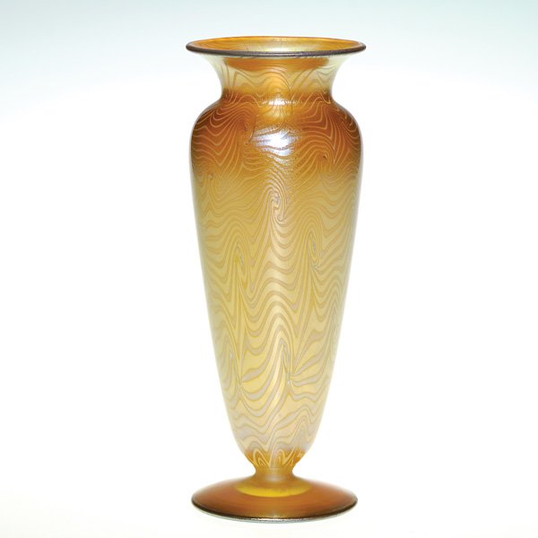 Victor Durand “King Tut” footed vase, 8”, signed,: Victor Durand vase on foot, the golden body proudly displaying the companies mesmerizing “King Tut” pattern. Rising 8 inches the vessel shows the silver “V Durand” mark and the shape number pl