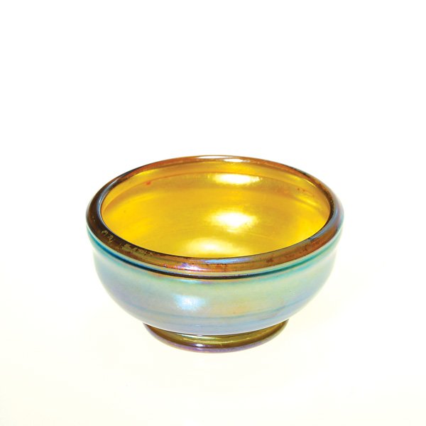 Tiffany master salt, gold, footed, roll rim, sign: Tiffany master salt cellar in iridescent gold. Height a mere 1 1/4 inches, the 2 1/2 inch rim is tightly rolled inward. Signed “L.C.T. Favrile” on the disc base. Beautiful excellent condition.
