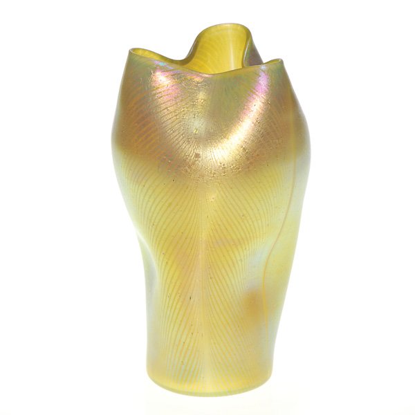 Loetz vase, pulled feather, gold, 7 3/4”: Nice golden Loetz vase, the body fully decorated with plumes of fleecy feathers. The artist placed depressions low on the body and gently squeezed the top to form a three folded rim. Height 7 3/8 inch