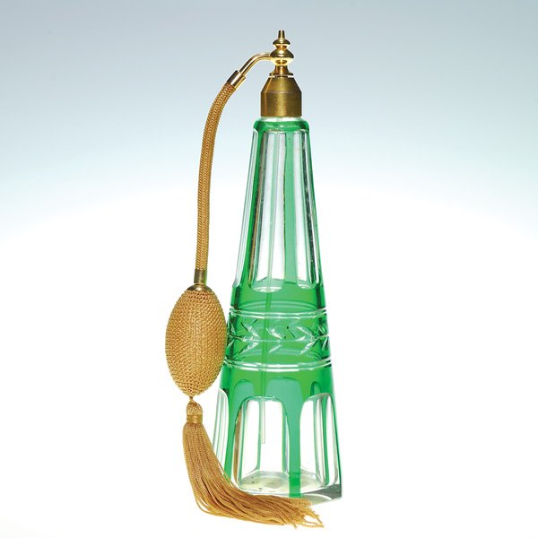 Baccarat atomizer, green cut to clear, 10”, marks: Tall Baccarat atomizer cut from emerald green to clear with a laurel leaf at the mid section enclosed by ached panels. The glass bears the Baccarat circular logo beneath. The metal top is impressed ��