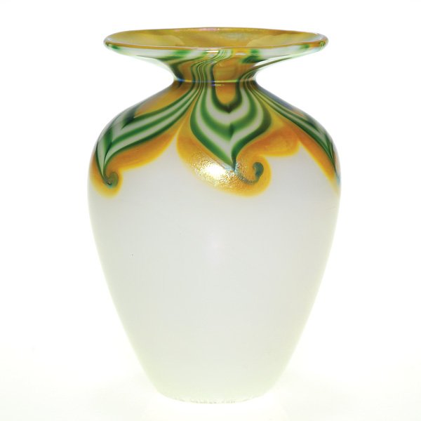 Steven Lundberg mini vase, decorated, 4”, signed: Miniature Steven Lundberg pearly white vase with a bright gold flaring rim, the shoulder enclosed by a shawl of green coiled feathering banded with gold. Height 4 inches. Engraved “S. Lundberg Glass