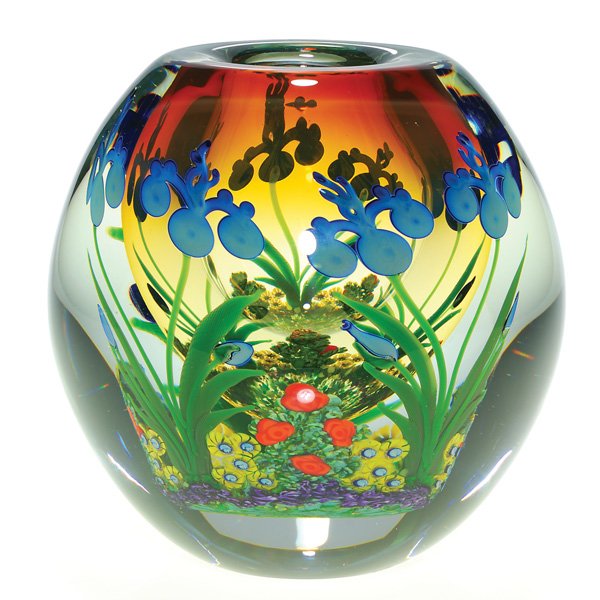 Chris Heilman vase, Iris & Garden, 6”, signed: Good Chris Heilman paperweight vase featuring a flourishing perennial garden with flowers at the peak of bloom, brightly preserved within. A flashy blush of orange tints the rim area. Height 6 inches,