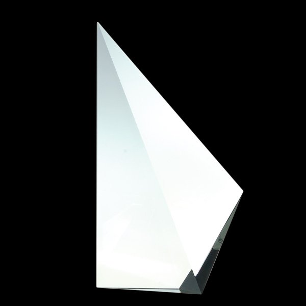 Christopher Ries “Prismatic Sail” 1988, 10 7/8”: Early Christopher Ries prismatic sculpture, fashioned from lead crystal then finely cut and smoothly polished to simulate the mainsail of a sailing vessel. Height 10 7/8 inches, width 6 inches. Mr. Ri