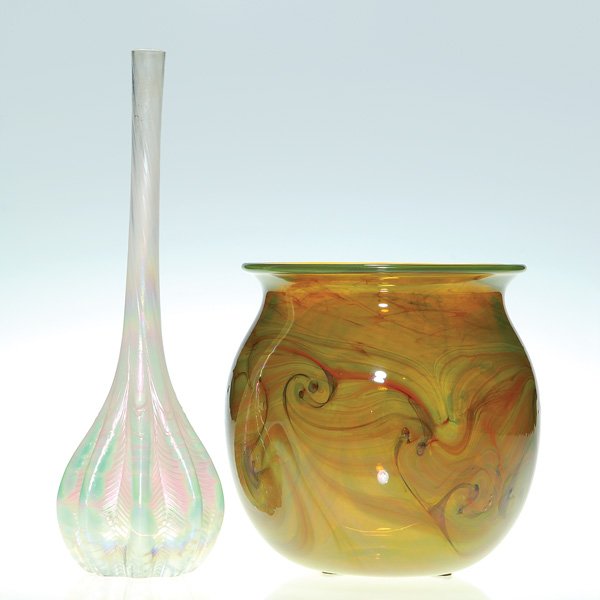2 vases: Early Carlson King Tut + Trout vase: Two vases: 1)Early Carlson caramel vase with swirling King Tut design. Height 5 3/8 inches. Signed and dated 1972. 2)Signed Trout Studios “Ball & Claw” stick vase, a pretty pale green with opal wh