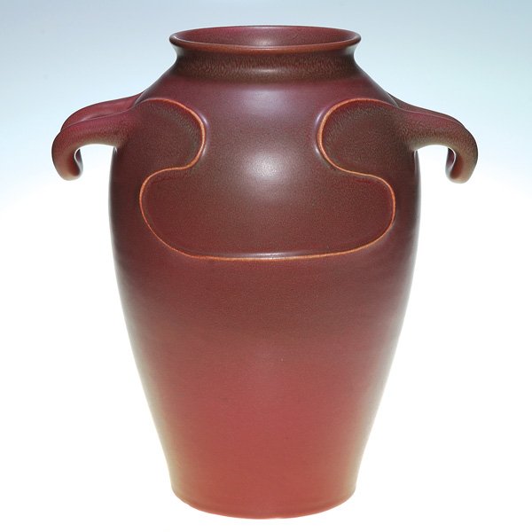 Rookwood 14” production vase, hand modeling, 1912: Large production vase made in 1912 and covered with a maroon mat glaze with mottled green highlights. Impressed with the Rookwood symbol, the date and shape 581 C. In excellent, original condition. Th