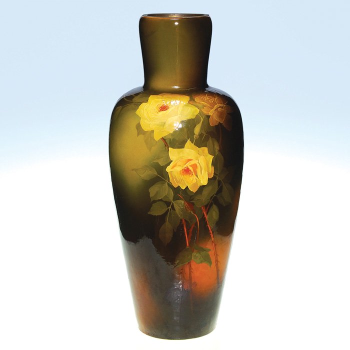 Weller Louwelsa tall vase, roses, Leffler, 29”: Tall Weller Louwelsa floor vase with bright yellow roses done by Claude Leffler. Impressed Louwelsa Weller on the bottom and signed by Leffler on the side near the base. The vase was used as an oil la