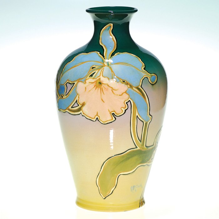 Roseville Rozane Royal 14 1/4” vase, L. Mitchell: Lovely Roseville Rozane Royal vase decorated by Lillie Mitchell with orchids, which she outlined in black. Marked with the raised Rozane Ware wafer with the Royal “wing” and signed “L. Mitchell�