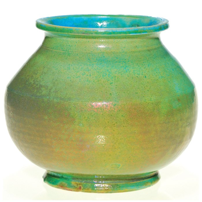 Pewabic 5 1/2” vase, luster green glaze: Pewabic Pottery vase covered with iridescent luster glazes of green, brown and blue. Impressed with the circular Pewabic Detroit logo. There are some “glazed over at the factory” chips and a short