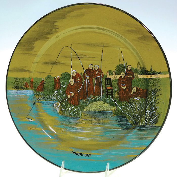 Buffalo Pottery 13 1/4” charger “Thursday” monks: Buffalo Pottery Deldare 13 1/4 inch charger depicting monks fishing and titled “Thursday,” and bearing the signature of the artist, H. Biddle, to the left of the scene. Marked Buffalo Pottery and