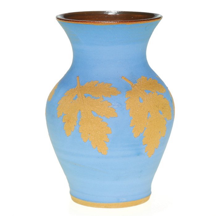 Scheier Hillcrock Pottery 5 1/8” vase, c 1939: Hillcrock Pottery vase crafted by Edwin and Mary Scheier circa 1938-39, featuring oak leaves encircling the vessel. Impressed with the Hillcrock Pottery logo. In excellent, original condition. Height