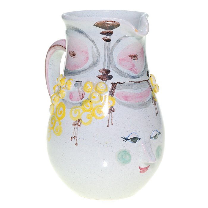 Bjorn Wiinblad 6 1/2” pitcher: Whimsical pitcher with the face of a young woman, yellow and pink fruit and various accents, the work of Bjorn Wiinblad (1918-2006) in 1955. Marked with the artist’s logo, the date and country of or