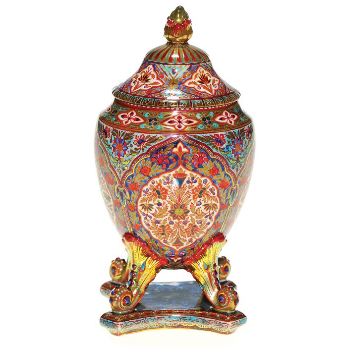 Zsolnay covered urn, Persian-style design,5 1/4” : Notable Zsolnay miniature urn lofted upon scrolled legs of acanthus leaves and topped with a dainty cover. The components are elaborately decorated with an intricate Persian-style design via enameling
