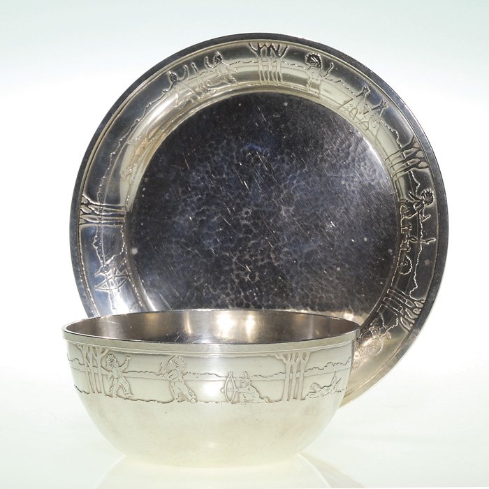 Marshall Field sterling bowl and undertray: Marshall Field sterling bowl and undertray. The 2 inch by 4 5/8 inch bowl and 6 1/2 inch tray are bordered with Indian children at play. Both pieces impressed “MF & Co. Colonial, Sterling” and 129