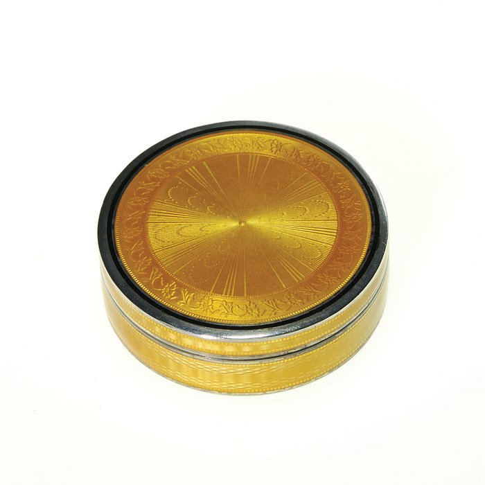 Guillochè enamel round patch box, 2 3/8”dia: Guillochè enamel and silver round patch box with floral and basket weave designs in golden amber. Height 3/4 inches, diameter 2 3/8 inches. Minor 1/4 inch loss of enameling in the side. Impressed 279