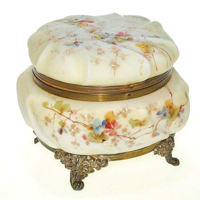 Wavecrest Helmschmied Swirl box, metal base, 6”: Large Wavecrest box with bouquets of blue and red violets and gray foliage attractively displayed over an antiqued Helmschmied Swirl body. Ornate metal scroll feet loft the box 6 inches. The metal pla