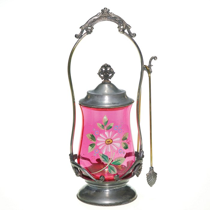 Homan pickle castor,enameled ruby insert, 11 1/4”: Victorian Homan Silverplate covered pickle castor. The 4 1/2 inch cranberry red insert with optical ribbing and hand enameled with a daisy and some forget-me-nots. The fancy holder bears the Homan Sil