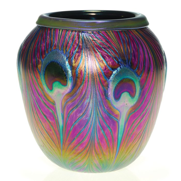 C. Lotton vase, peacock feather, 6 1/2”, signed: Nice Charles Lotton vase graced with six lifesize peacock feathers with dark “eyes” centered among iridescent blue barbs and placing the plumes against a beautiful reddish purple “speckled” ba