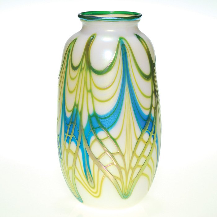 C. Lotton vase, turquoise, 9 1/4”, ‘79, signed: Early Charles Lotton produced in 1978. The 9 7/8 inch vessel began with Charles pulling turquoise about opal white body then applying what resembles the golden wings of a dragon fly. Charles signed hi