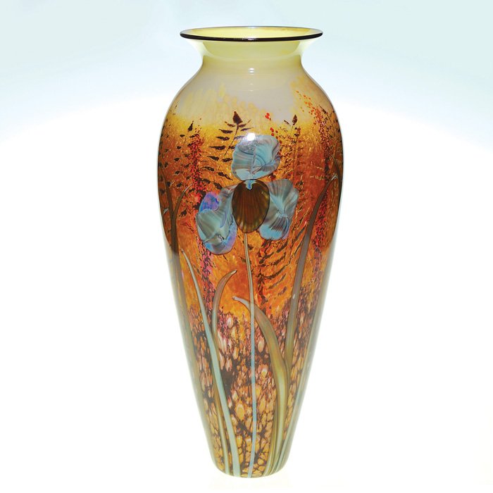 Satava vase, California Gold Meadow, 16”, signed : Satava “California Meadow” vase arranged with a trio of irises abound by ferns rising towards a sky of opal yellow. Height 16 inches. The flowers are opal blue gray with a russet beard and set aga
