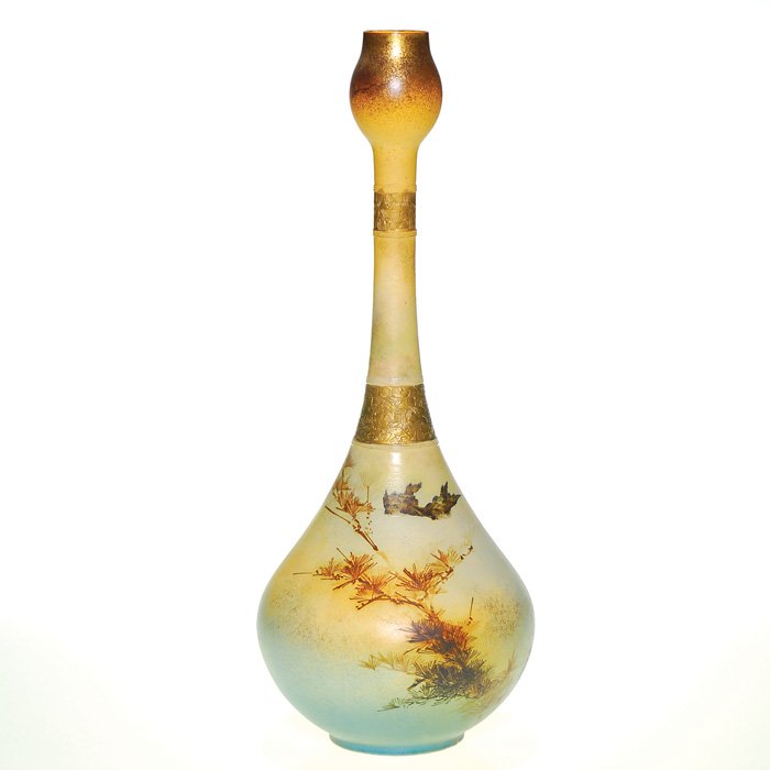 Rookwood Dull Finish 17 3/4” vase, Daly, 1885: Tall Dull Finish vase decorated by Matthew Daly in 1885 depicting two birds flying over a pine tree with lots of fired on gold enhancement. Impressed Rookeoof in block letters, with the date, shape 23