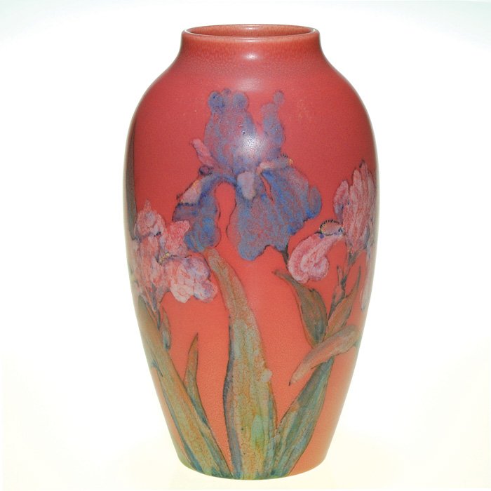 Good Rookwood Mat 10.5” vase, irises, JWP, 1929: Decorated mat glaze vase that has been encircled with white and blue irises, striking against the brick red ground, the work of John Wesley Pullman in 1929. Impressed with the Rookwood symbol, the dat