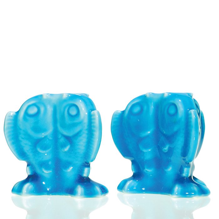 Rookwood pair 3 5/8” Fish candle holders, 1928: Pair of Fish candle holders, designed by Shirayamadani, each depicting a trio of fish standing together, their mouths conjoining to form the aperture for the candle, cast in 1928 and covered with a gl