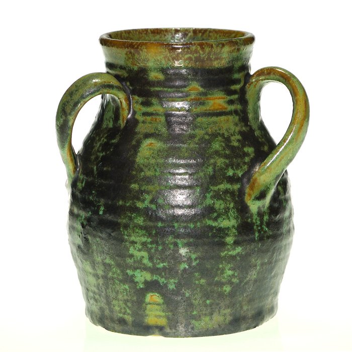 Fulper Colonial vase with 3 spiral handles, 6 3/8”: Fulper “Colonial” ridged vase with 3 spiral handles with a thick charcoal glaze distributed over green. Height 6 3/8 inches. Ink stamp racetrack logo beneath. Nice glaze. Excellent original condit