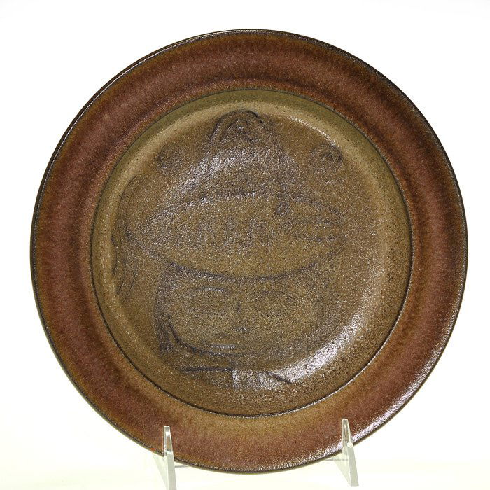 Scheier low bowl, fish design, 9”: Edwin and Mary Scheier 9 inch stoneware low bowl with decorations inside, the most central of which is a fish, and covered with two tones of gray glazes, the one on the outer ring having a purple cast