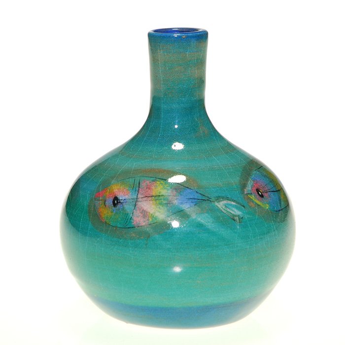 Polia Pillin bottle with fish, 4 1/2”: Polia Pillin bottle shaped light blue vase with four rainbow colored fish encircling the piece. Signed “Pillin” in black slip on the bottom. Height 4 1/2 inches. Overall crazing.