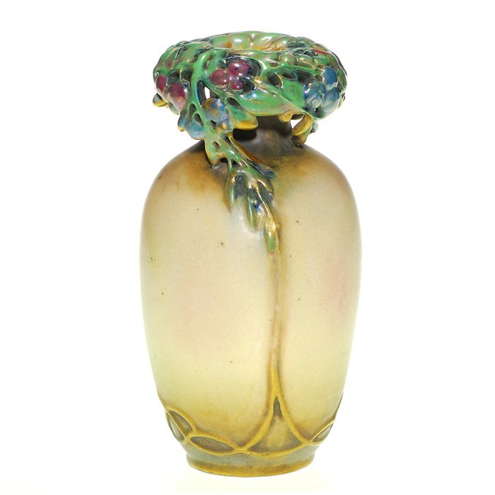 Amphora vase, reticulated berry rim, 7 3/4”: Unusual Amphora vase with an overhanging rim consisting of iridescent leaves and fruit which connect to the body and extend down to the base. Marked with a faint oval “Amphora” mark. Height 7 3/4